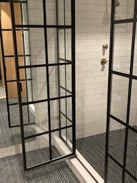 a bathroom with a glass shower door